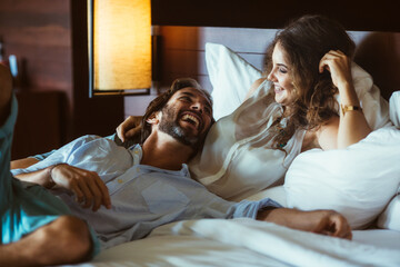 Happy Couple Relaxing in a Hotel Room