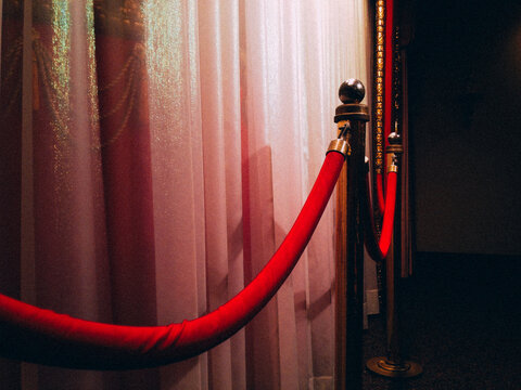 Red rope next to a puppet theater stage