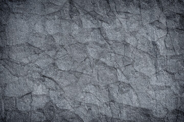 Dark grey black slate stone background or texture.