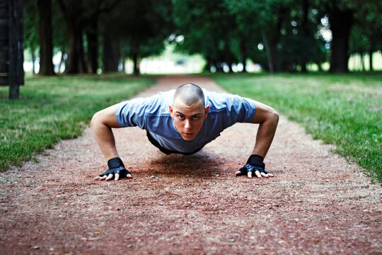 Male exercising by doing push up