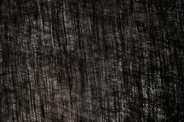 abstract rough dark background linen natural fabric, short focus