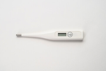 Top view of portable thermometer on white background