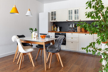 Modern design interior of dining room, kitchen, white furniture