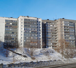 Soviet apartment buildings. Apartment block. Soviet architecture. Ust-Kamenogorsk (Kazakhstan). Concrete apartment buildings. Dark. Winter cityscape. Plattenbau. Urban grunge
