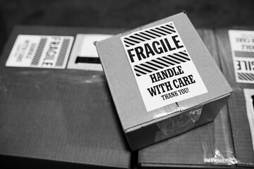 Shipping boxes marked ""fragile - handle with care""