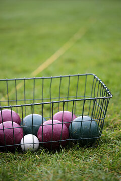 A Bocce Ball Set On A Grassy Lawn Ready For Play