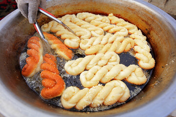 Mahua, a traditional Chinese food is fried in oil, North China