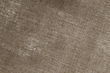 creative background: reverse side of primed linen, translucent spots of white primer paint