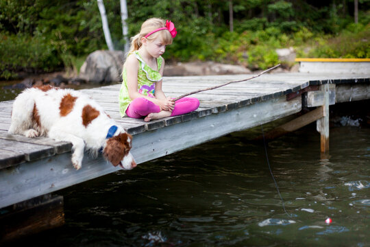 Little Girl Fishing In Cottage Lake