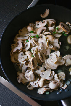 Cooking mushrooms in a pan