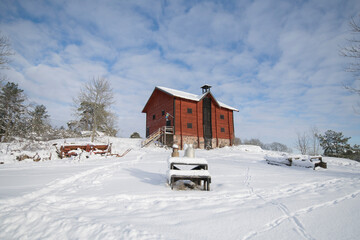Winter view over a barn house on the Drottningholm island in Stockholm. 2021-01-10