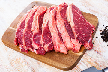 uncooked beef marbled steak served with pepper on the table