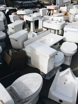 junk yard of bathroom fixtures