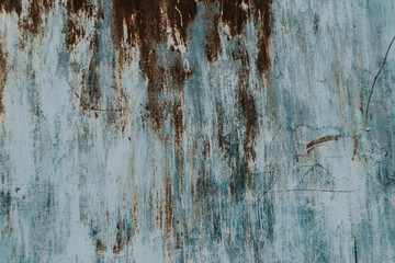 Multicolored background: rusty metal surface with peeling and cracking paint Natural defects Scratches, cracks, cracks, chips, dust, roughness, abrasion. Template for design and background.Copy space