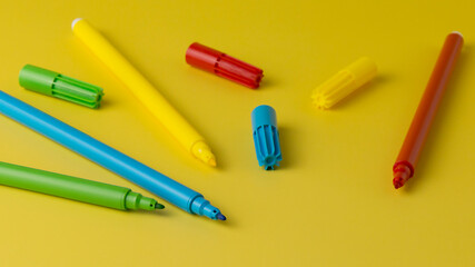 Multicolored Felt-Tip Pens isolated on a yellow background