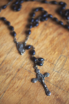vintage rosary beads on table