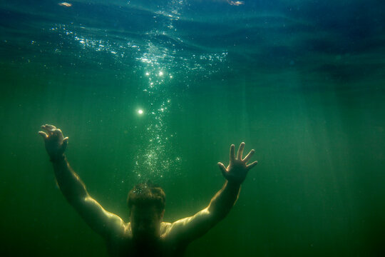Man Sinking Underwater Like Depression