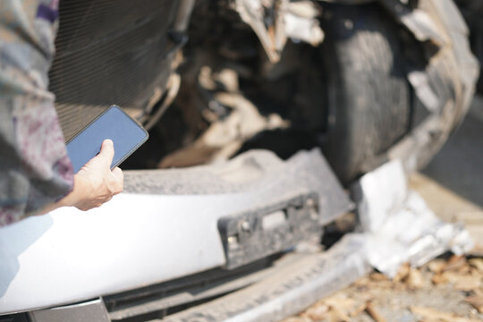 hand take photo of crashed damaged broken car. automobile crash accident