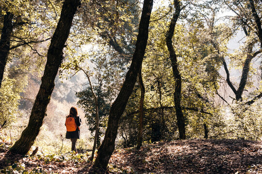 The girl with the orange backpack