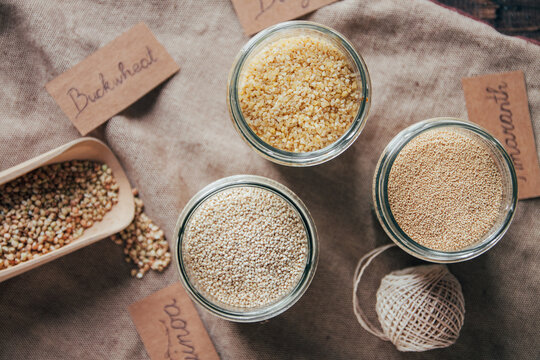 Quinoa, amaranth, bulgur and buckwheat in jars