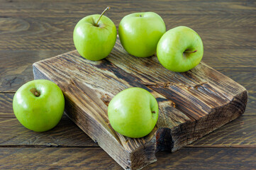 Green ripe apples on wooden desk. Rustic style. eco-friendly farming. sustainable food