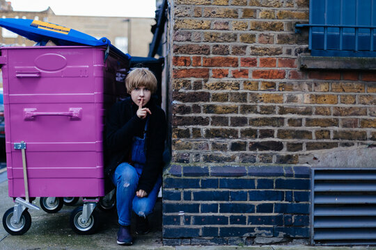 Young Woman Hiding on the Street of London