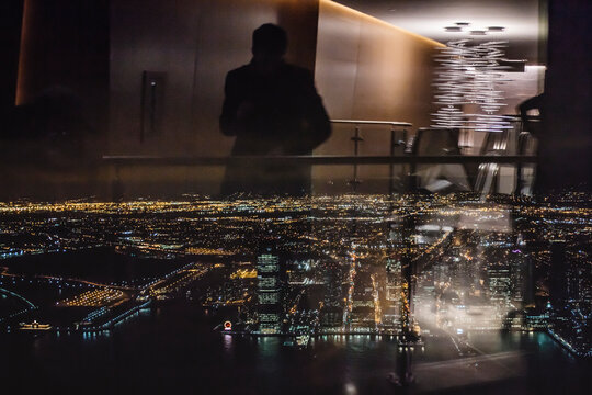 reflections in the window,Night cityscape,view from 102 floor on the New York streets and buildings