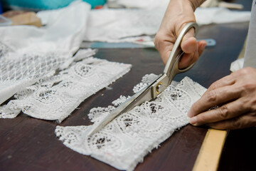 Women sewing scissors,  measuring tape and sewing machines, sewing workplaces