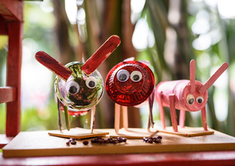 Colorful grasshopper toy made of recycling waste