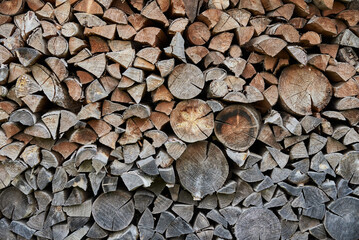 Preparation of firewood for winter season. Firewood background