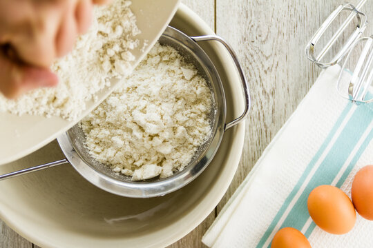 Pouring flour into sieve