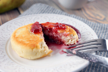 Delicious lush homemade cheesecakes on a wooden table