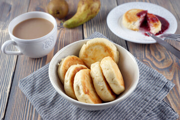 Delicious lush homemade cheesecakes on a wooden table