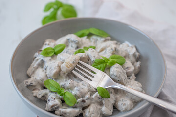 home made gnocchi with mushrooms and arugula