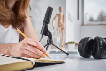 Woman records online podcast at home, podcasting concept