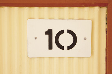 10 painted on a tin plate.