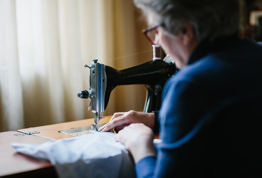 Senior woman working on a sewing machine