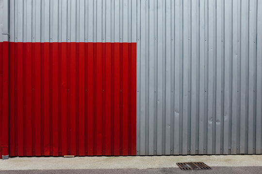 Red Square Painted on Corrugated Metal Wall