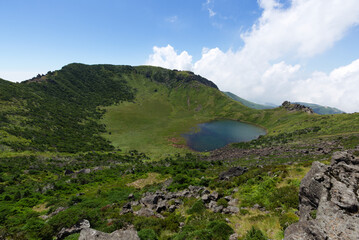 Fototapeta na wymiar Crater lake on peak of Hallasan Mountain, South Korea. It is formed by the collapse of the top of the ridge by the movement of magma underground.