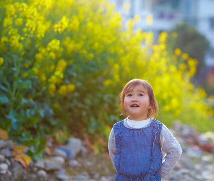lovely asian litle girl in spring field