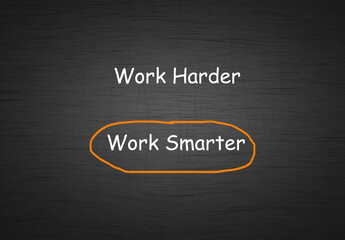 Work harder vs work smarter comparison concept with text in chalkboard