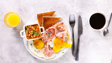 english breakfast with egg, bacon and coffee cup