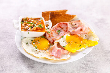 english breakfast with egg, bacon and toast