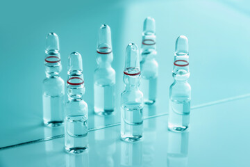 Glass ampoules with medicine close-up.