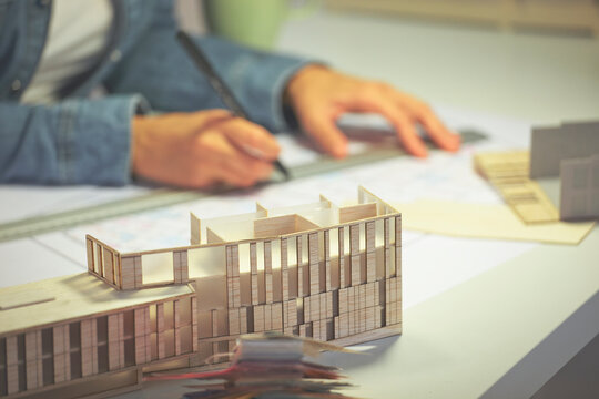 Close up of a creative woman working on plan at office.
