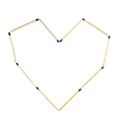 Heart made of matches on white background