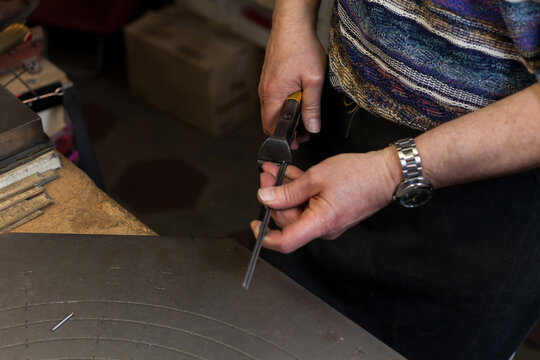 Artisan at Work in his Workshop making lampshades.