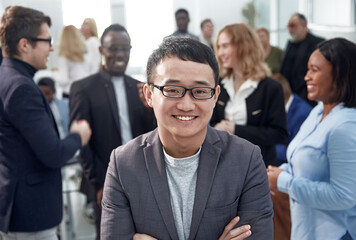 close up. happy young businessman standing in the office.