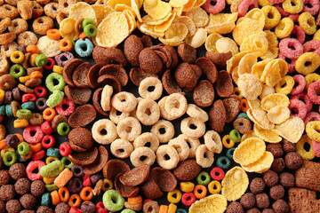 Heap of tasty breakfast cereals as background