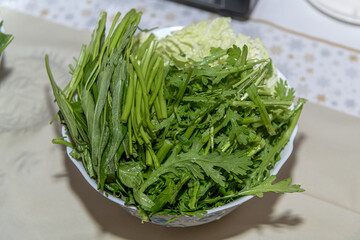 Homemade fried tofu and Chinese salad ingredients for a Chinese vegan fondu soup